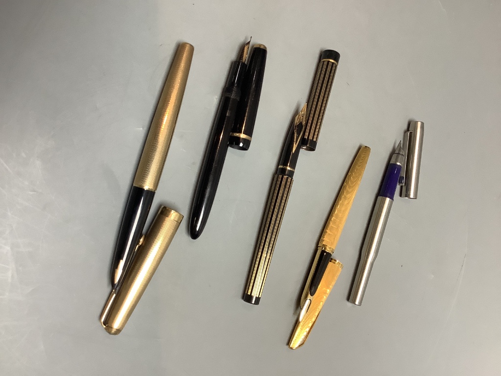 Five assorted pens to include a 9ct gold Parker